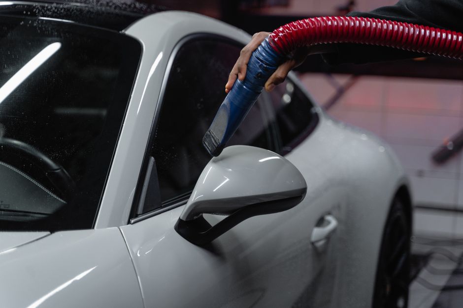 Detailer performing a meticulous hand car wash